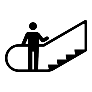 Persona en la parte baja de escalera mecánica con pasamanos